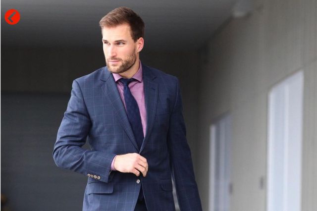 Kirk Cousins wearing a suit with his rumored hair transplant