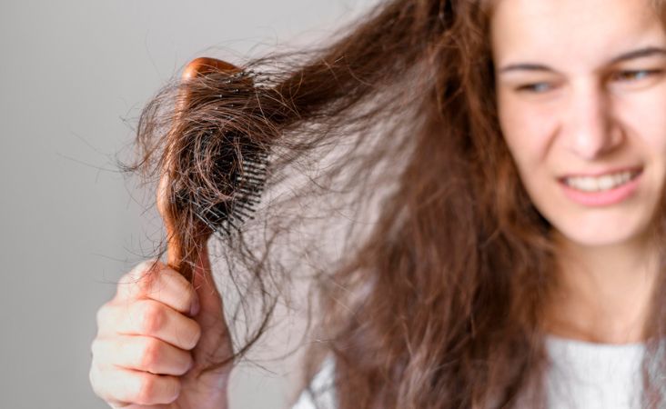 girl brushing her hair