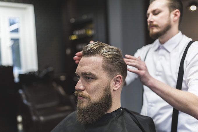 hairstylist adding highlights and lowlights