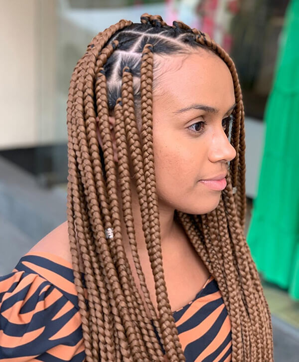 Woman with box braids protective hairstyle
