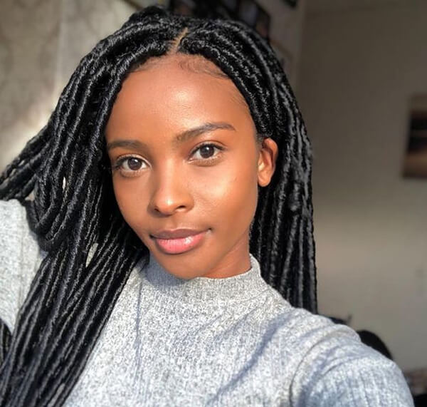 Black woman with faux locs hairstyle