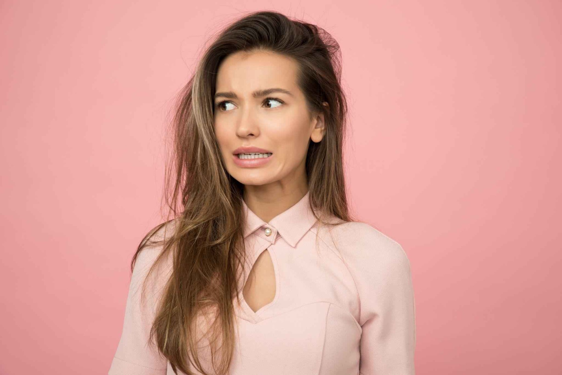 Woman looking concerned about hair loss